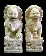A Pair of Marble Temple Lions with Stand